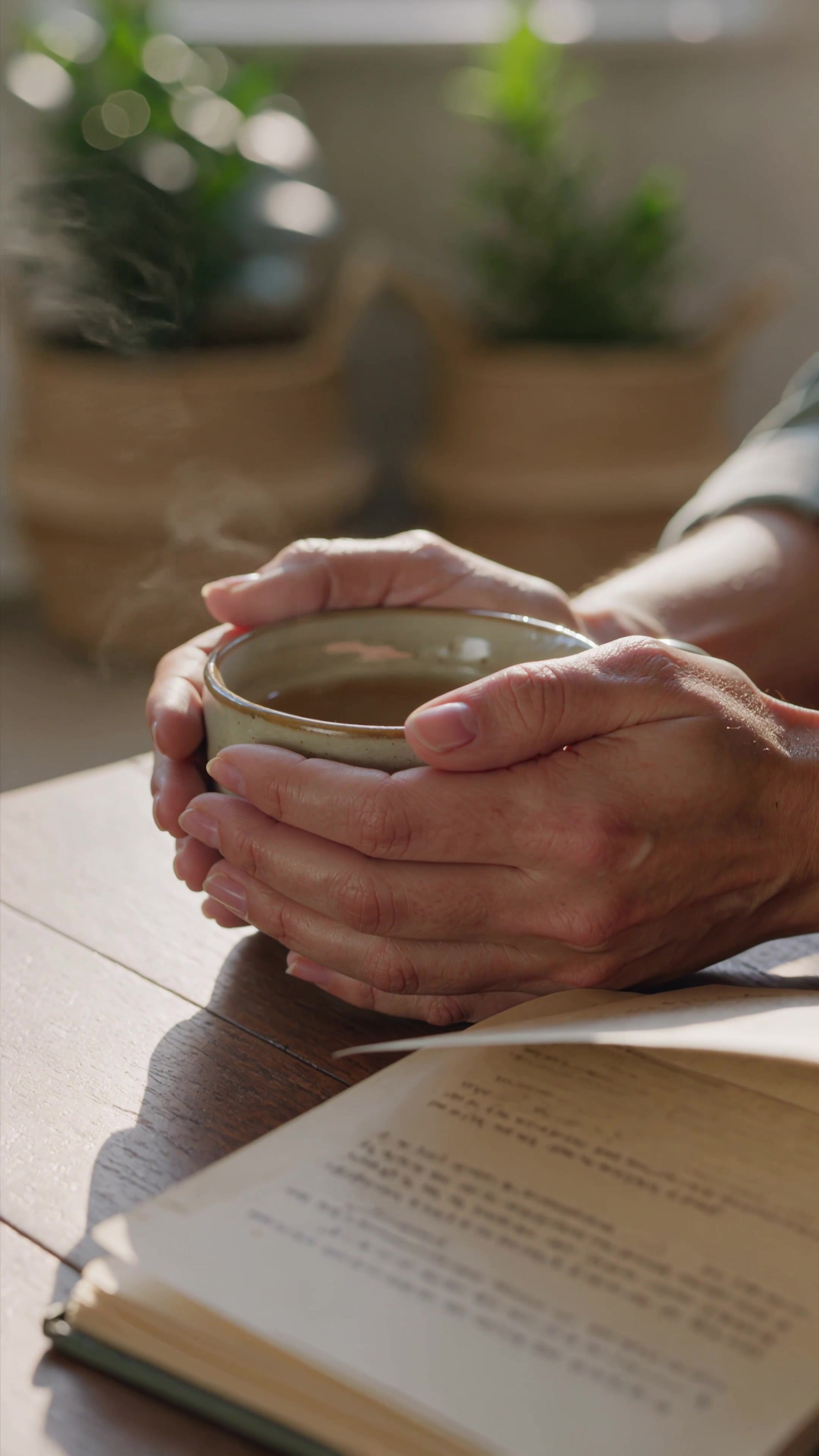 Hands holding journal in golden light